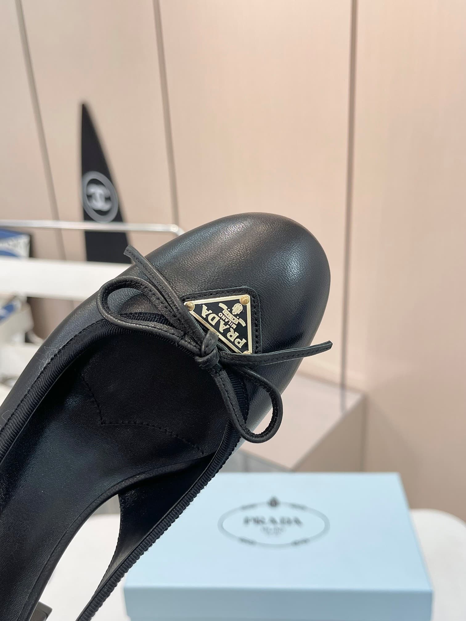 PRADA TRIANGLE LOGO BOW SLINGBACK PUMP IN BLACK - Image 6