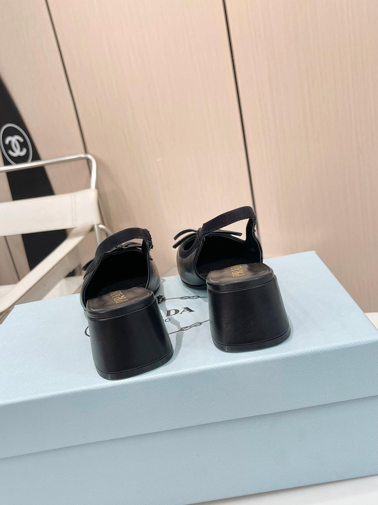 PRADA TRIANGLE LOGO BOW SLINGBACK PUMP IN BLACK - Image 4