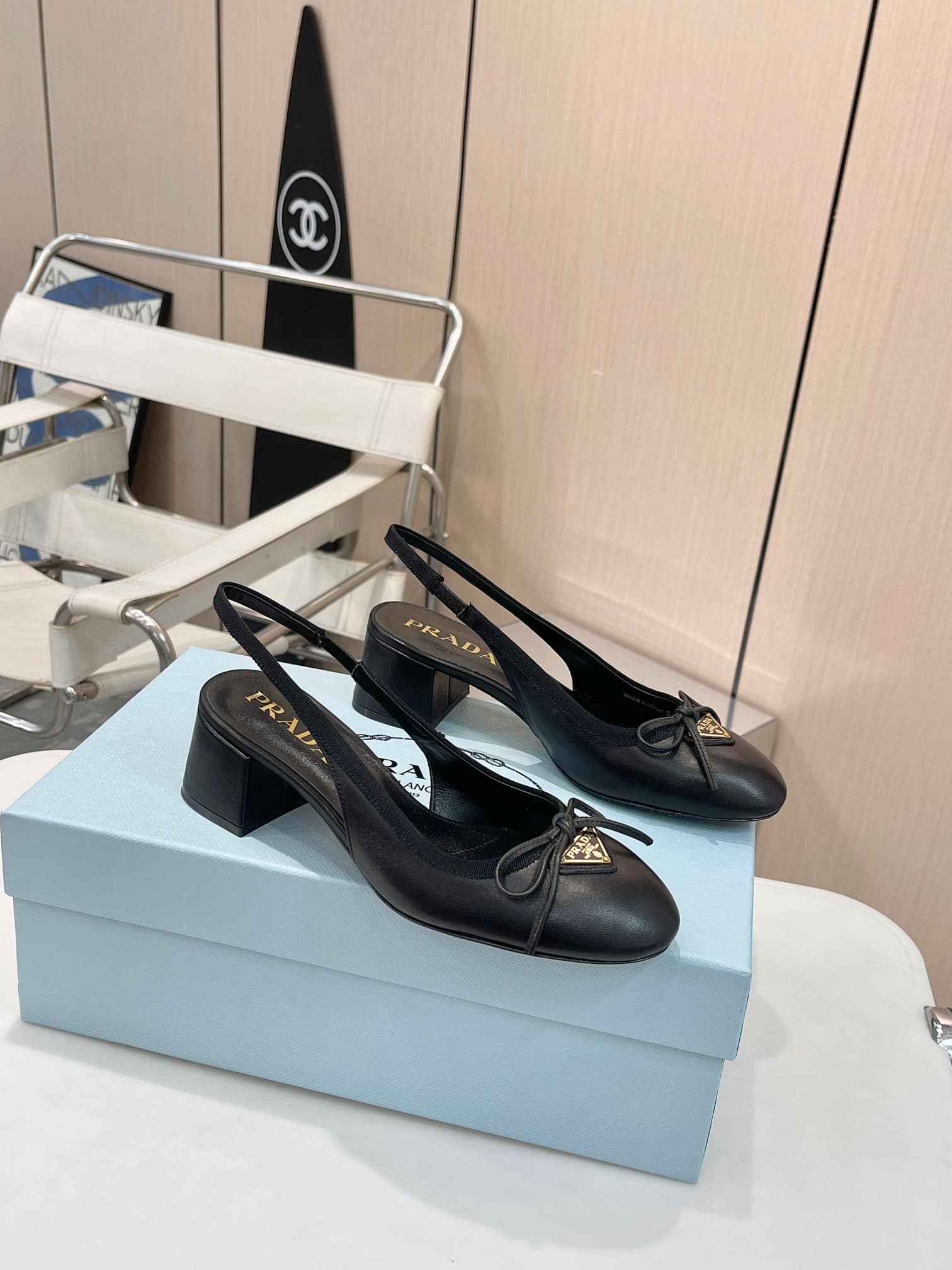 PRADA TRIANGLE LOGO BOW SLINGBACK PUMP IN BLACK - Image 3