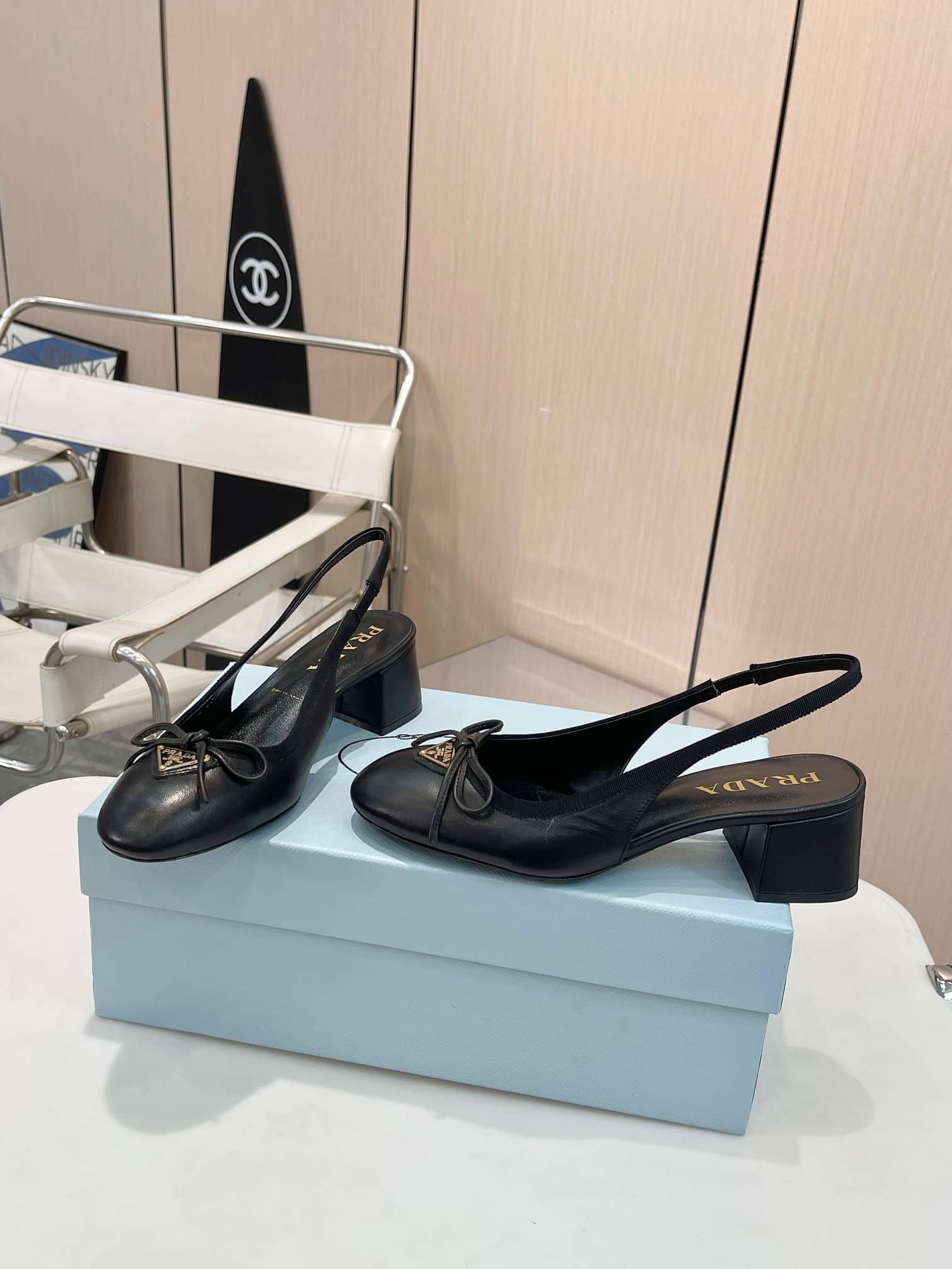 PRADA TRIANGLE LOGO BOW SLINGBACK PUMP IN BLACK - Image 2